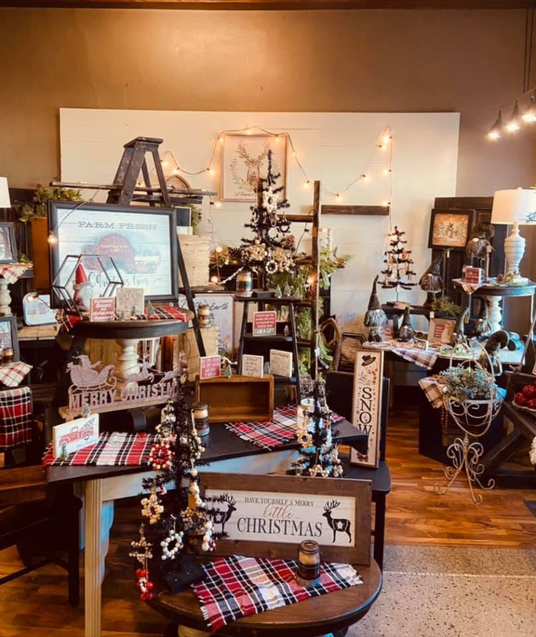 A cozy shop with a Christmas tree and holiday gifts.