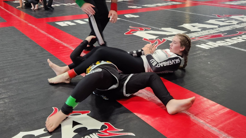Two athletes grappling on the mat at Silverback Brazilian Jiu Jitsu.