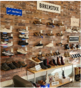 A wall of shoes and finds at a local shop.